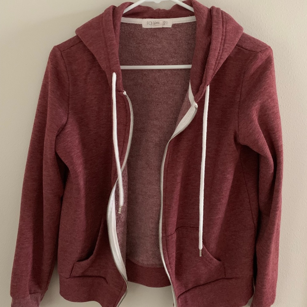 red zip up jacket